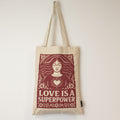 Nomad Sari Iconic Toni Tote Bag - Love is a Super Power - Natural 10oz product image